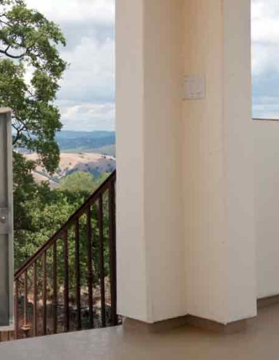 Residential dumbwaiter opening onto the top deck of a home