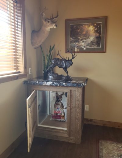 dumbwaiter tucked under a side table (door open)