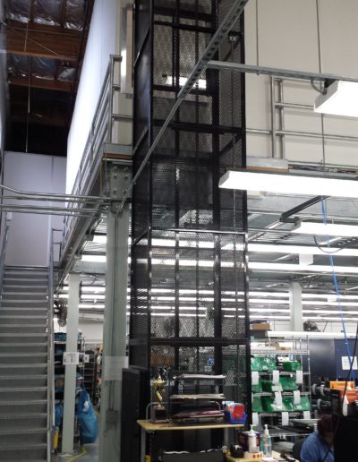 Mezzanine Lift Spanning Both Floors